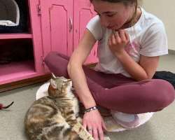She loves to play with her cat.